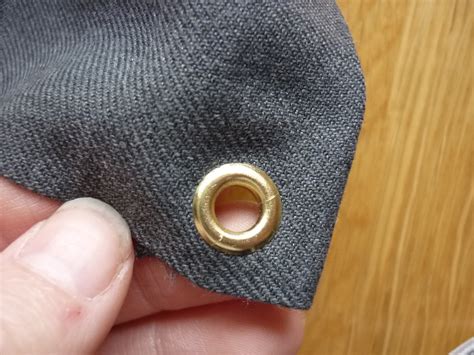 metal ring reinforcing hole in fabric|How To Make Eyelets In Fabric: A Comprehensive Guide.